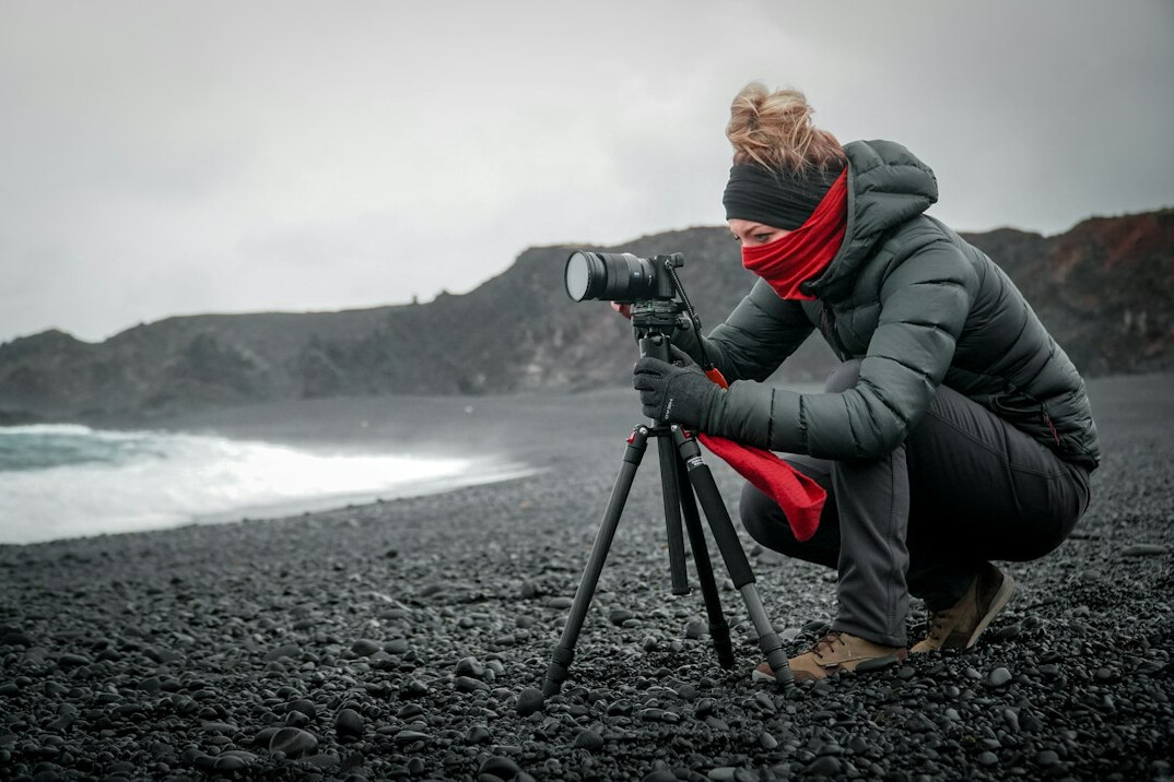 Portrait of a Danish female photojournalist holding a camera
