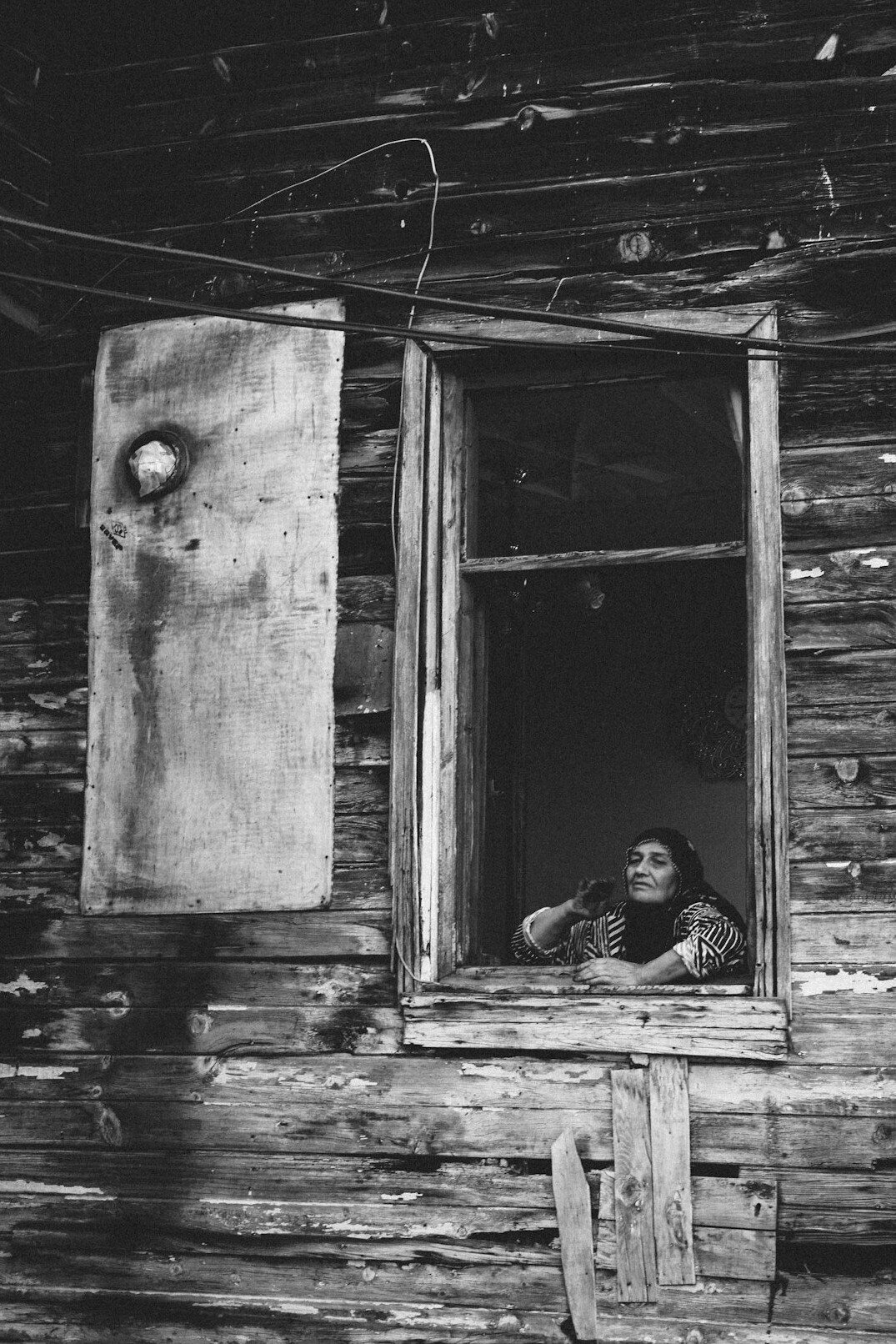 elderly woman in window